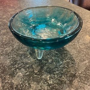 Teal blue hand blown glass dish with 3 legs.